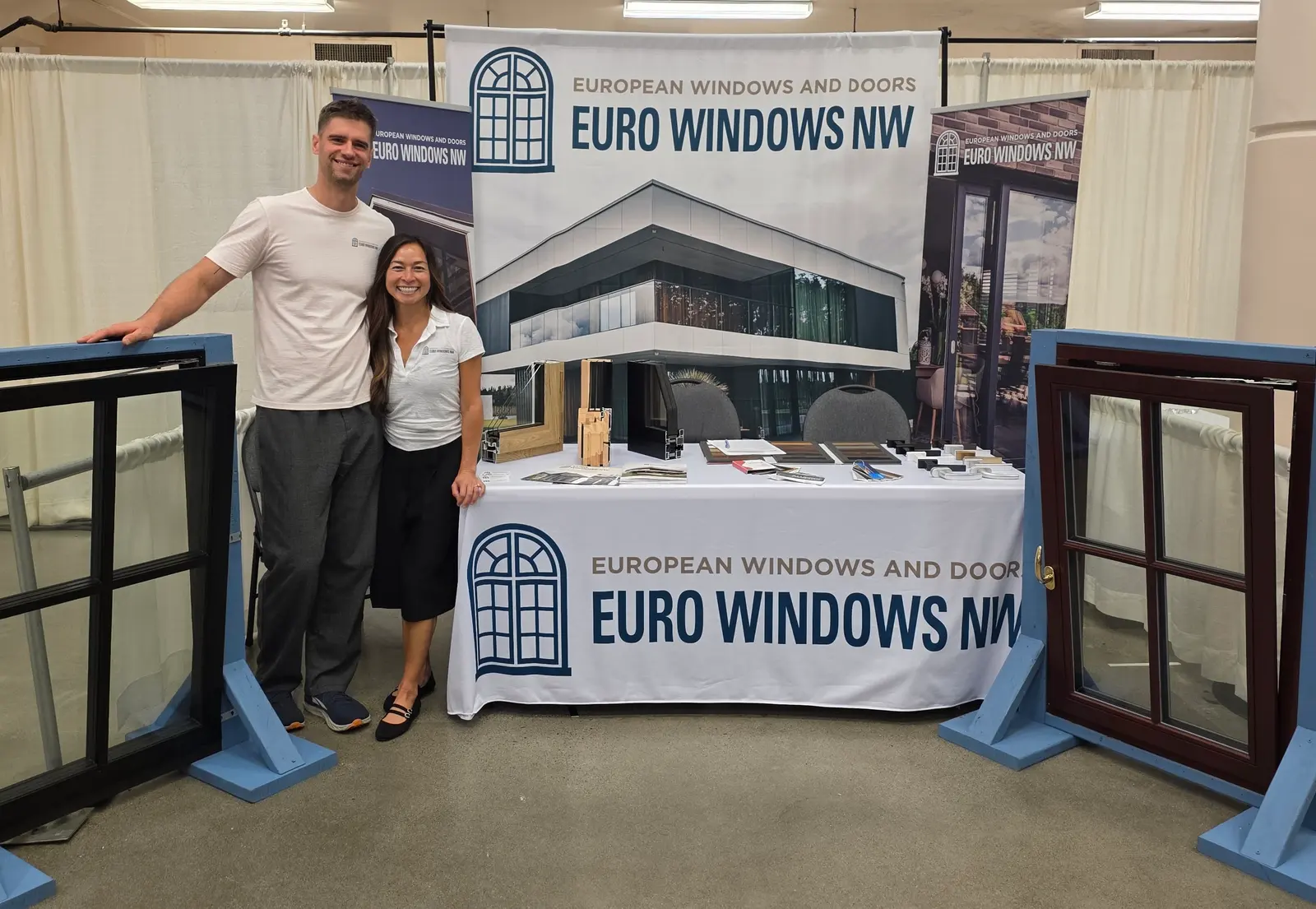 Euro Windows NW team at our home show booth with European tilt-and-turn window samples