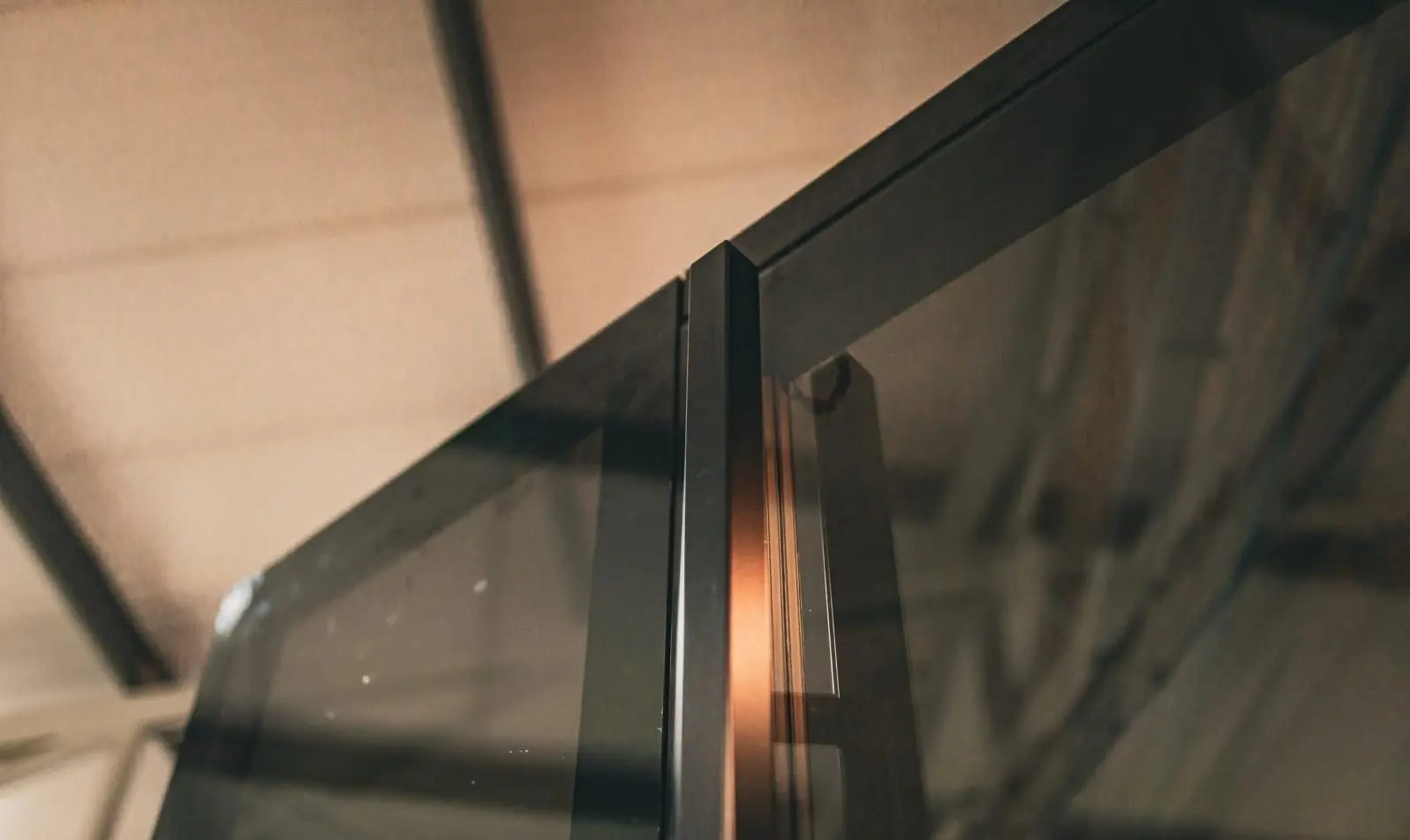 Cut aluminum window profile showing the polyamide thermal break between inner and outer halves