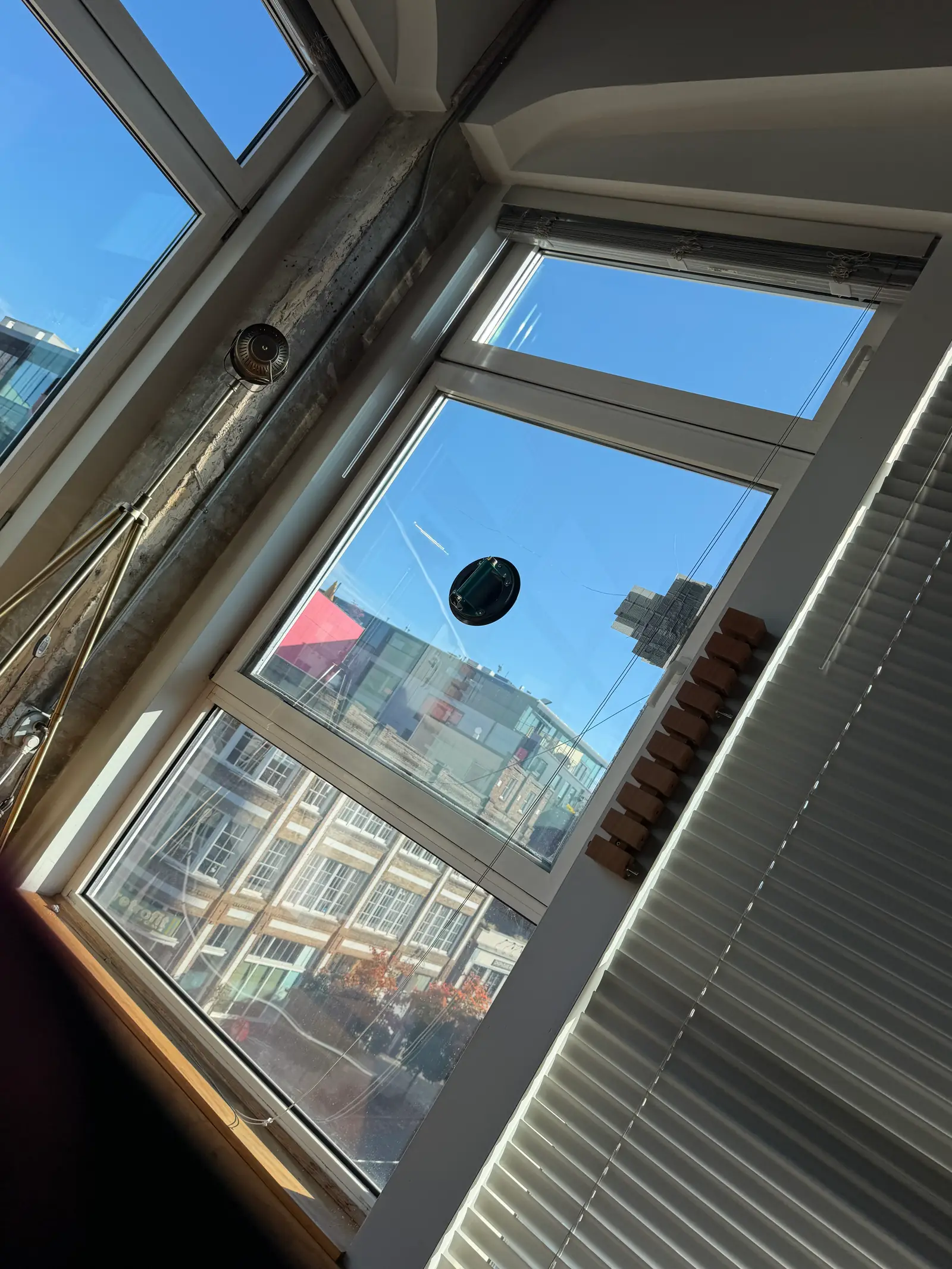 Tilt-and-turn window with new glass, seen from inside a Capitol Hill condo