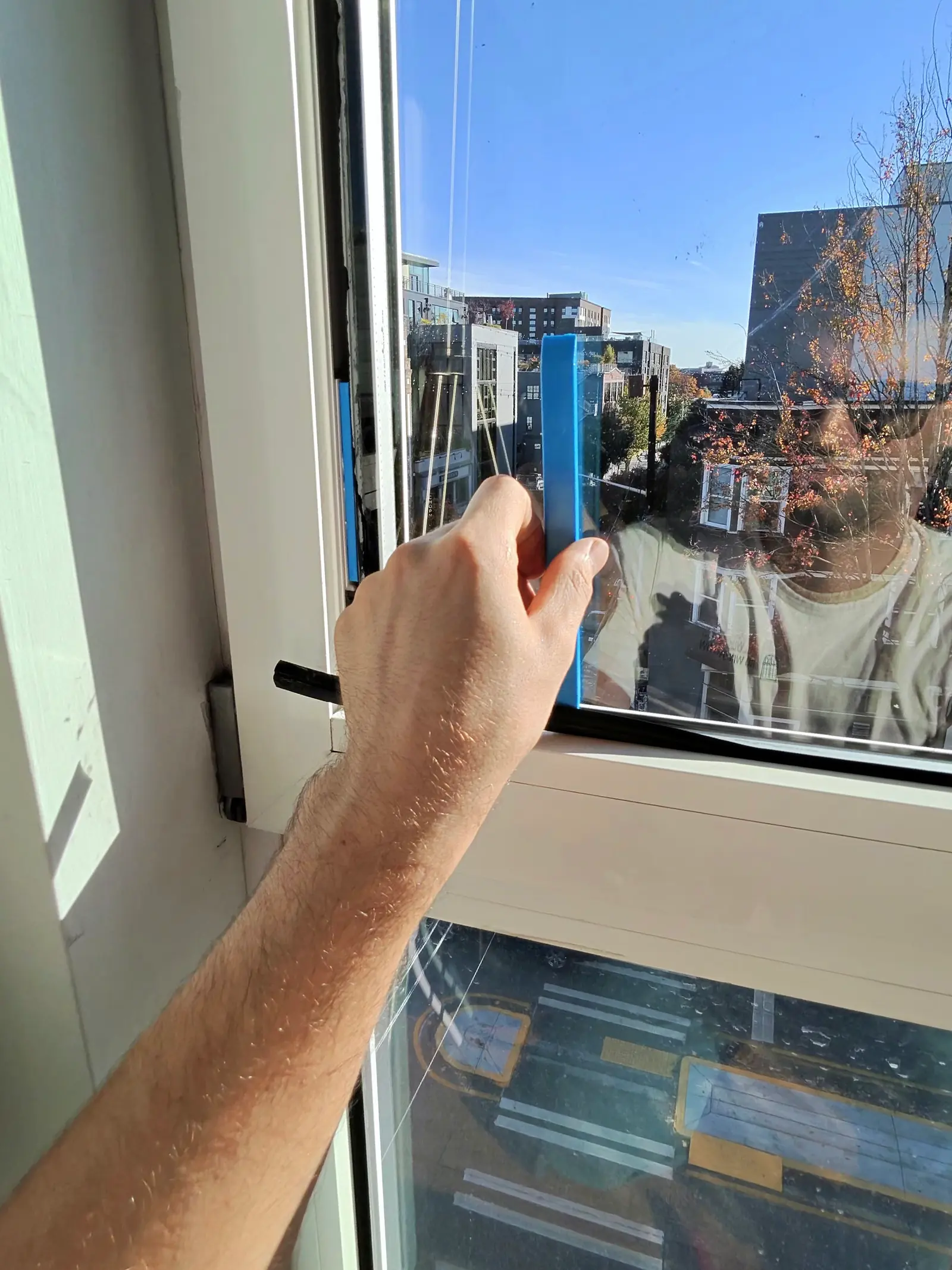 Removing the glazing beads from a European tilt-and-turn window to take out broken glass