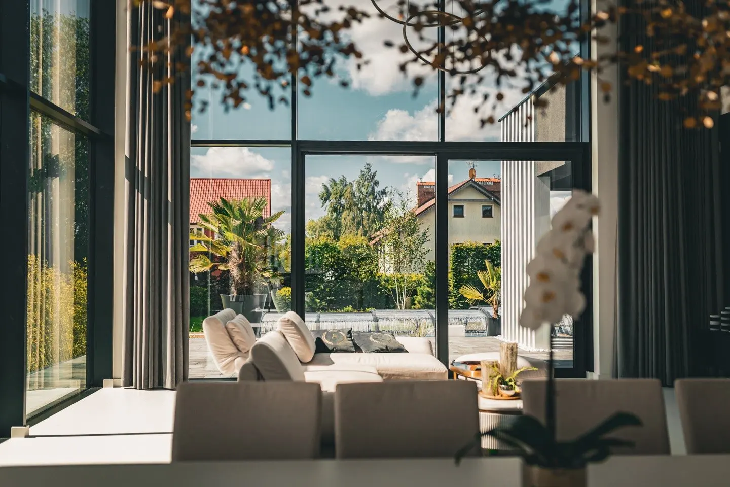 Inspiration, European project overseas: double-height living room with tall tilt-and-turn windows