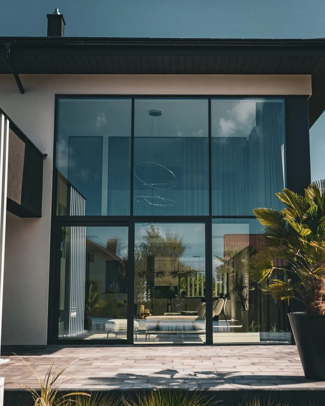 Inspiration, European project overseas: floor-to-ceiling dark-framed glass wall