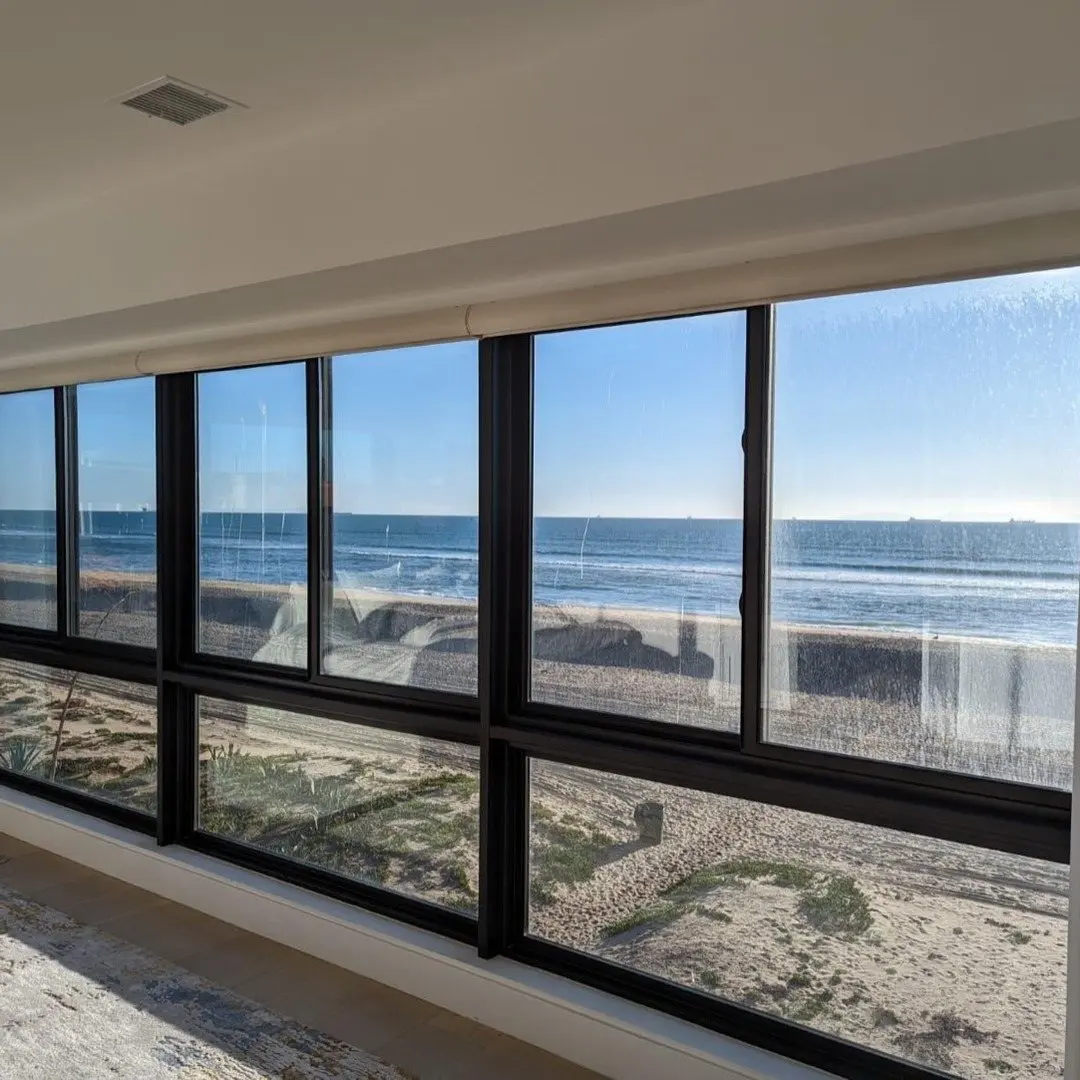 Partner project, not our own installation: living room with dark-framed windows