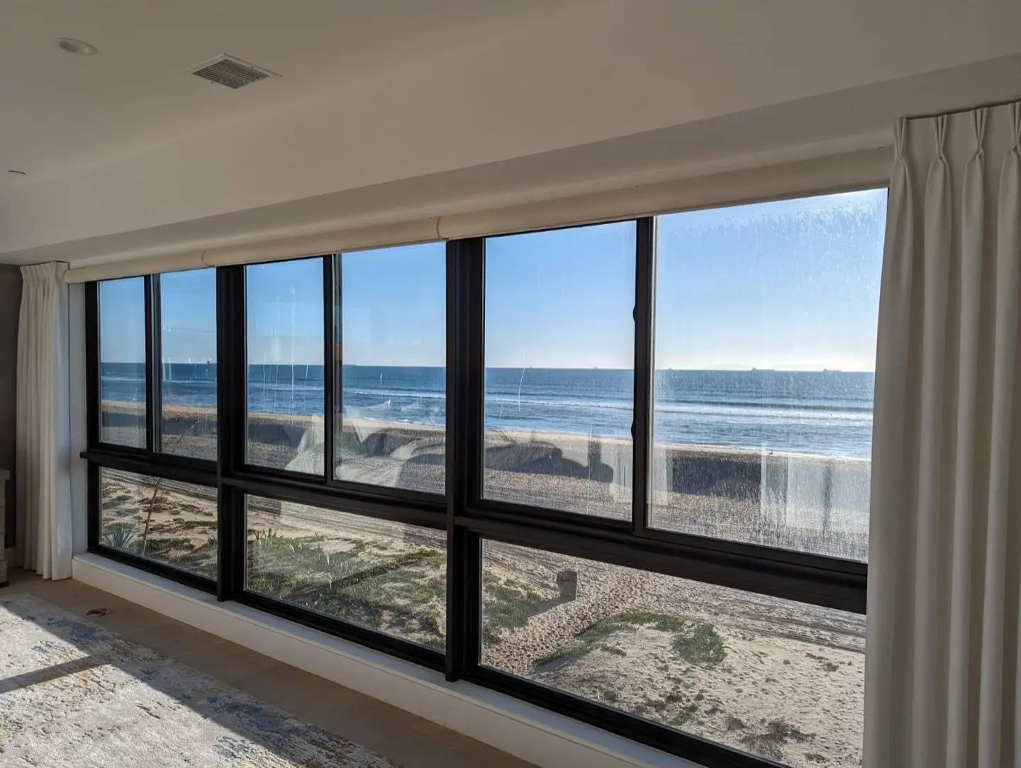 Partner project, not our own installation: large fixed windows facing the water