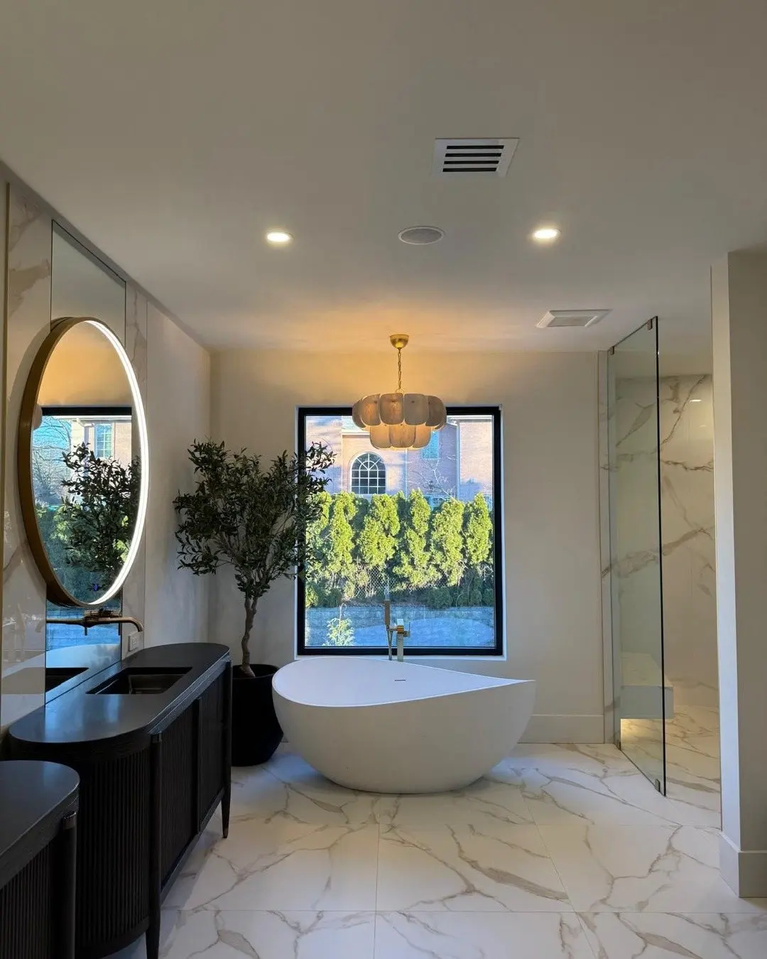 Seattle install: freestanding tub under a black tilt-and-turn window