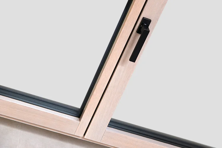 Wood sash tilted open with a black handle
