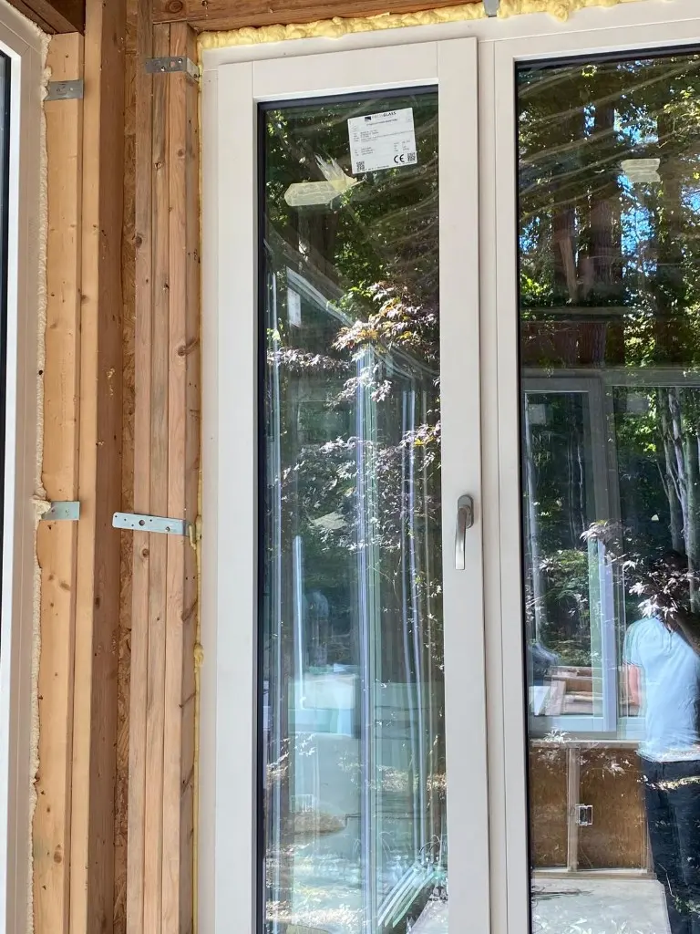 White interior frame and handle of a Synergic window during installation