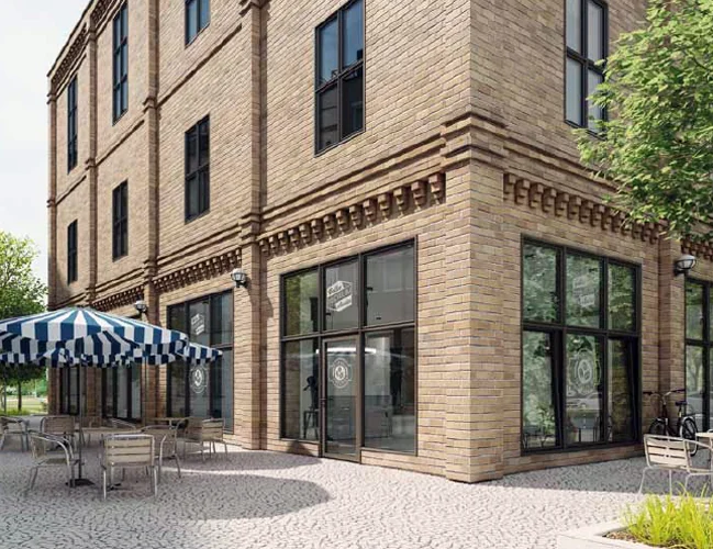 MB-Ferroline Pro aluminum windows and storefront, dark steel-look frames on a brick building