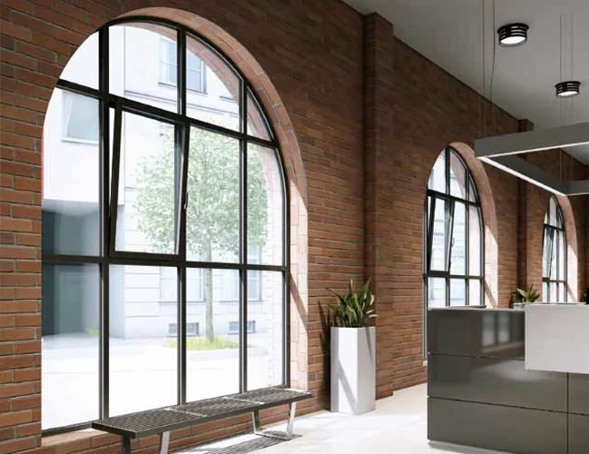 MB-Slimline aluminum windows, dark arched frames in a brick interior