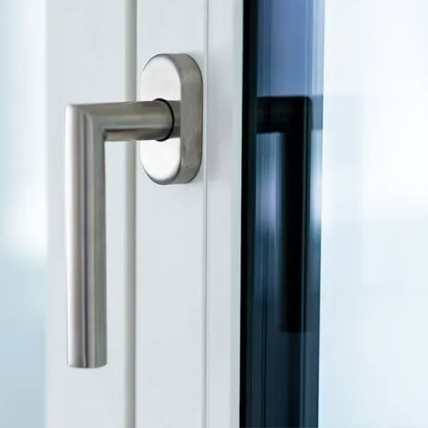 Brushed stainless window handle on a white P-500 uPVC sash