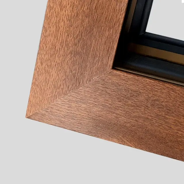 Corner of a European window showing adjustable hardware and gaskets